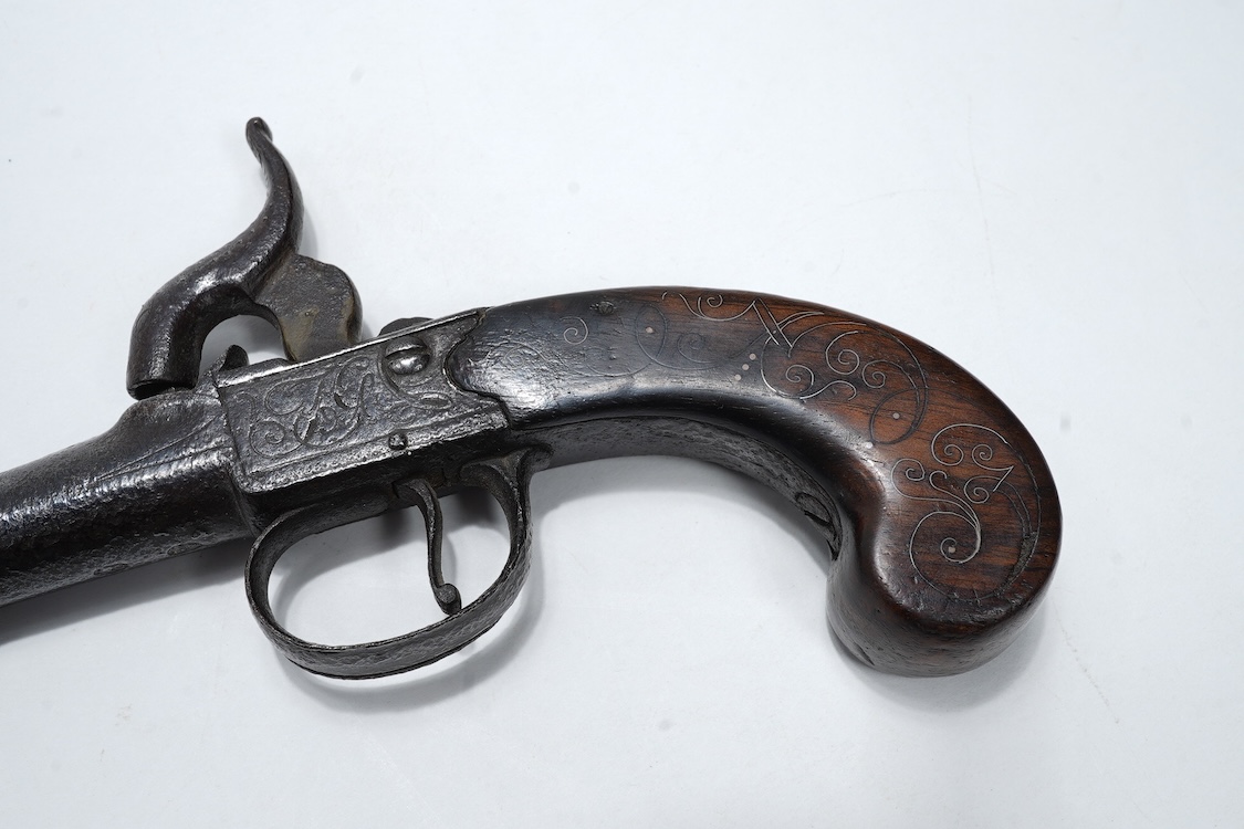A boxlock percussion travelling pistol, with turn off cannon barrel, 5cm, and London proof marks, frame engraved; TG, with slab walnut grip with silver wire inlay